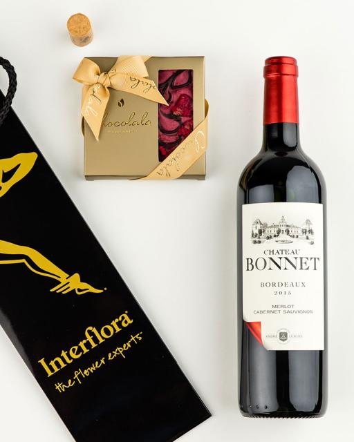 Gift bag with Chateau Bonnet red wine and dark chocolate raspberry bar