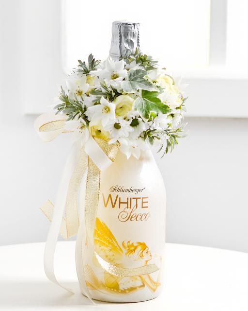 Sparkling wine with white flower arrangement