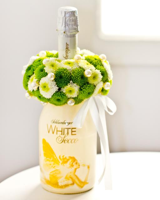 Sparkling wine with flower arrangement